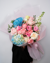 Pastel candy flower bouquet from a flower shop in Dubai with soft pink and pastel blooms